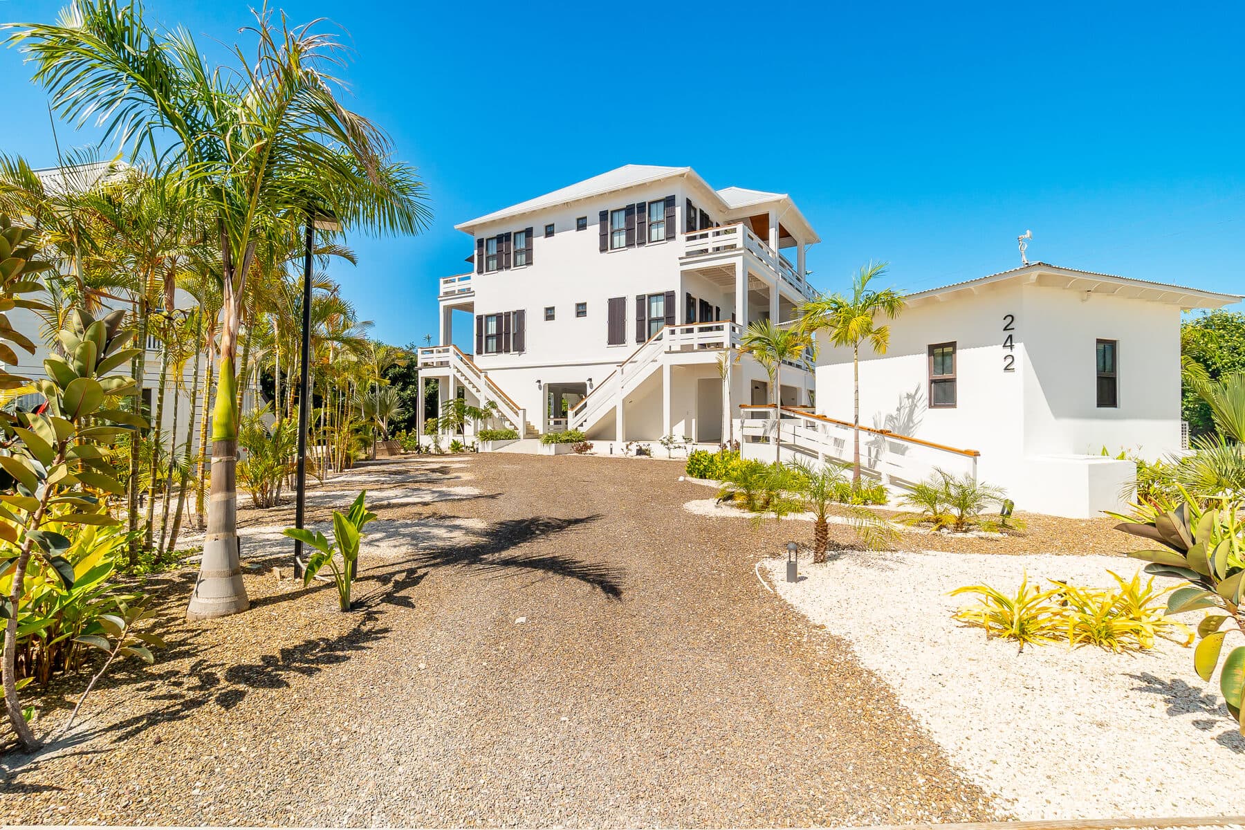 BelaDia compound arrival with tropical landscaping and private balconies